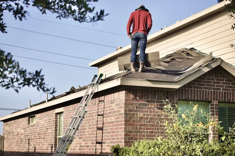Professional roofer working on a residential roof in Indianapolis